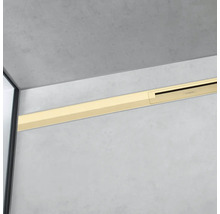 Goldfarbene Duschrinne an der Wand montiert