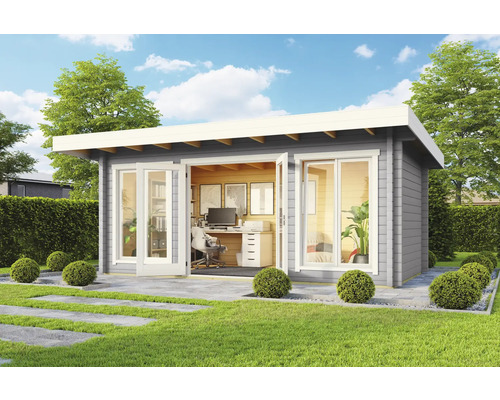 Modernes Gartenhaus mit Büroausstattung im Außenbereich auf Rasenfläche