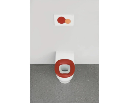 Weißes WC mit rotem Toilettensitz und Betätigungsplatte