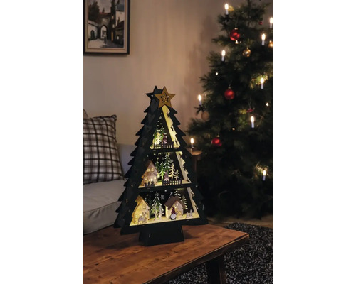 Dekorativer Weihnachtsbaum aus Holz mit LED Beleuchtung auf einem Tisch