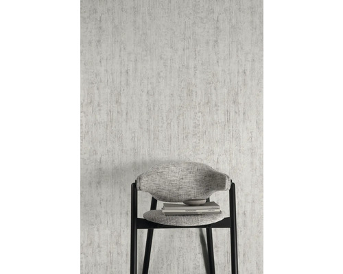 Nahaufnahme einer weißen Struktur Tapete mit einem Stuhl