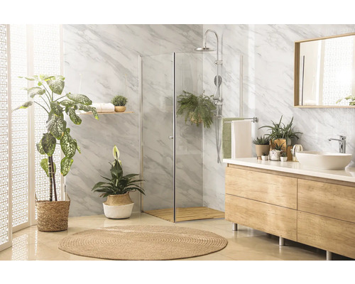 Modernes Badezimmer mit Dusche, Waschtisch, Spiegel und Pflanzen für eine natürliche Atmosphäre.