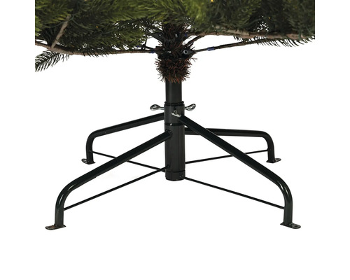 Detailaufnahme des schwarzen Metallfußes eines Weihnachtsbaums zur Stabilisierung.