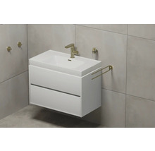 Waschtisch mit Unterschrank, Armatur und Handtuchhalter im Badezimmer