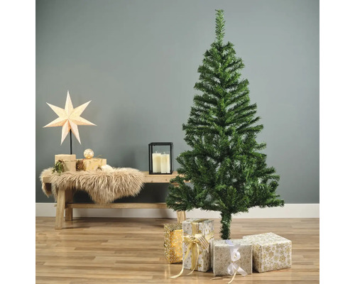 Dekoratives Arrangement mit unechtem Weihnachtsbaum und Geschenken