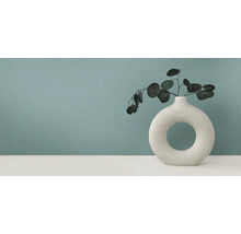 Dekorative Vase mit Pflanzen auf Tisch