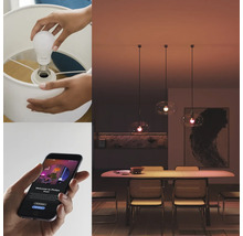 Person schraubt eine smarte Glühbirne in eine Lampe und bedient sie mit einer App.