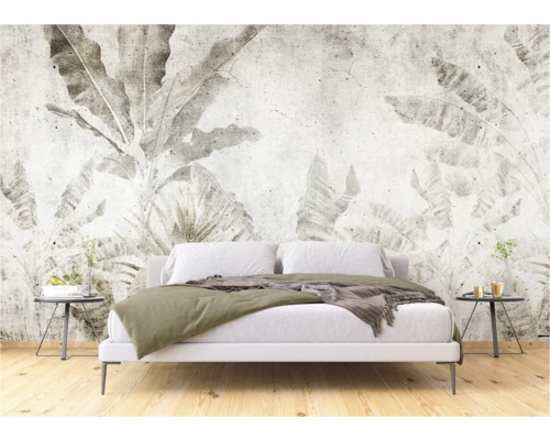Schlafzimmer mit einer Wandtapete mit Pflanzenmotiven, die eine ruhige Atmosphäre schafft.