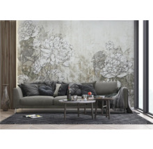 Wohnzimmer mit Sofa, Couchtisch und floraler Wandtapete für eine stilvolle Einrichtung.