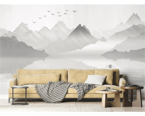 Wohnzimmer mit Fototapete mit Berglandschaft, Sofa und Beistelltischen