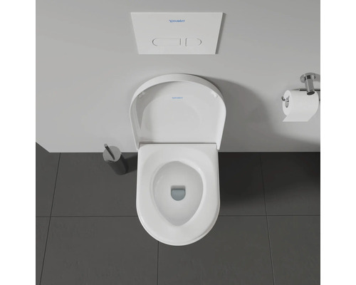 Aufnahme von oben einer Toilette mit Spülkasten und Toilettenpapierhalter