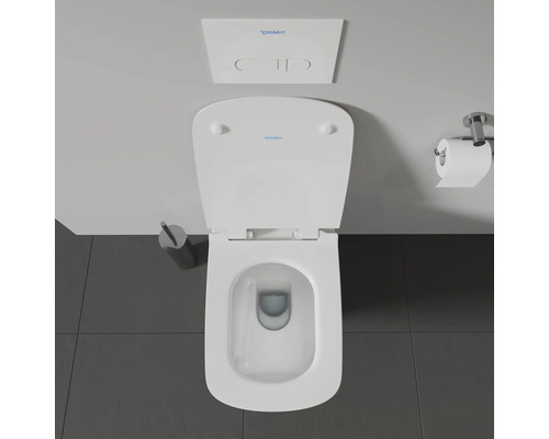 Aufnahme von oben einer Toilette mit Spülkasten und Toilettenpapierhalter