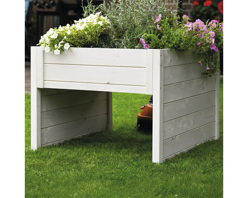 Hochbeet aus Holz mit Blumen bepflanzt im Garten