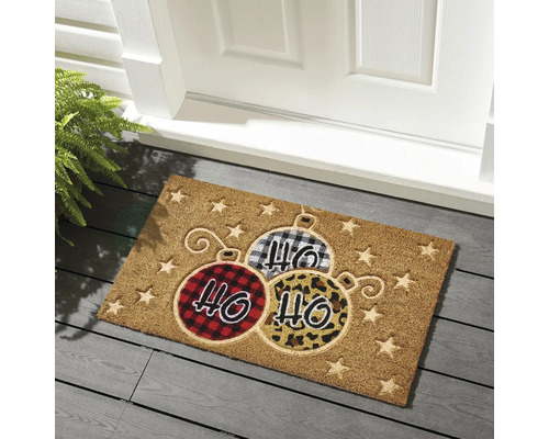 Fußmatte mit Weihnachtskugel-Design vor einer Tür