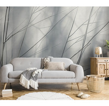 Wohnzimmer mit Sofa, Beistelltisch und dekorativer Tapete für eine gemütliche Atmosphäre.