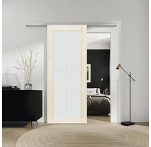 Raumszene mit Schiebetür, Kommode, Teppich und Schlafzimmerblick