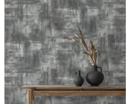 Dekorative Tapete mit abstraktem Muster in Grau und Weiß.