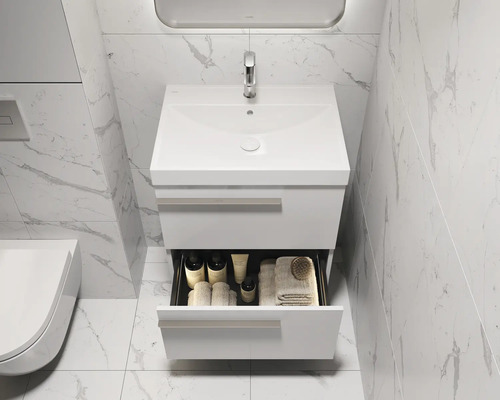 Badezimmer Waschbeckenunterschrank mit Schublade und Armatur vor einer gefliesten Wand