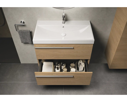 Waschtischunterschrank mit offenem Schubfach für Badutensilien im Badezimmer.