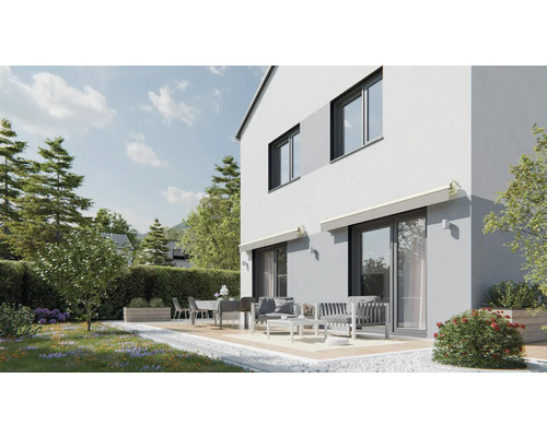 Modernes Haus mit Terrasse und Gartenmöbeln