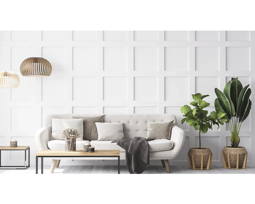 Helles Wohnzimmer mit Sofa, Tisch und Zimmerpflanzen