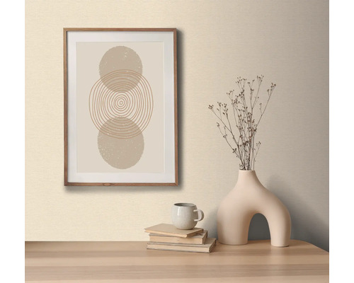 Dekoratives Bild mit Kreismuster im Holzrahmen, auf einem Tisch mit dekorativer Vase und Büchern