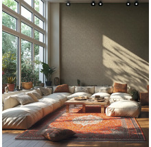 Helles Wohnzimmer mit großer Fensterfront, Ecksofa, Teppich und Holztisch
