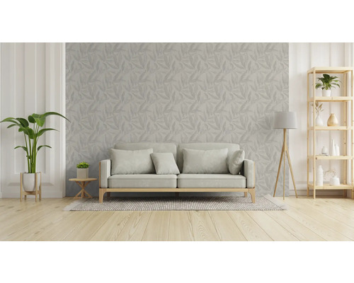 Wohnzimmer mit Sofa, Pflanze und Regal