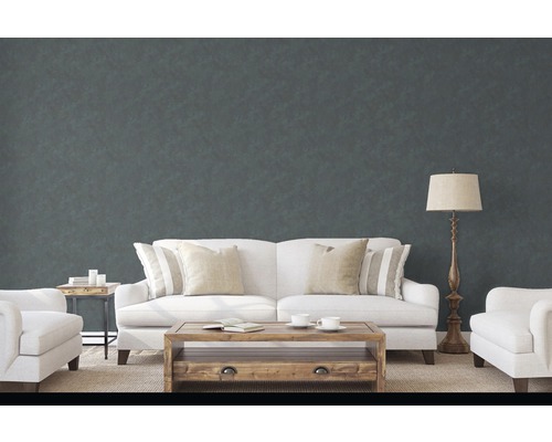 Wohnzimmer mit Sofa, Sessel und Couchtisch