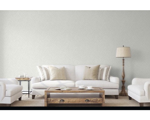 Wohnzimmer mit Sofa, Sessel, Tisch und Stehlampe