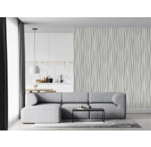 Wohnzimmer mit grauer Couch, Couchtisch und strukturierter Wand