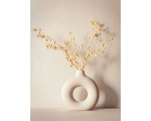 Dekorative Haferzweige in einer modernen Donut-Vase
