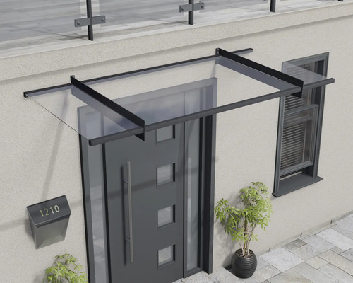 Modernes Vordach aus Glas mit schwarzem Metallrahmen über einer Haustür.