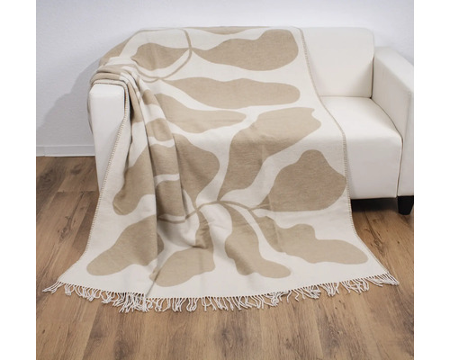 Decke mit Pflanzenmuster auf Sofa