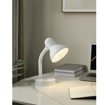 Schreibtischszene mit einer weißen Schreibtischlampe, einem Notizbuch und einem Laptop