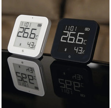 Zwei digitale Zimmerthermometer und Hygrometer in weiß und schwarz mit Anzeige von 26,6 Grad Celsius und 43 Prozent Luftfeuchtigkeit.