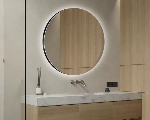 Modernes Badezimmer mit rundem Spiegel und Waschtisch