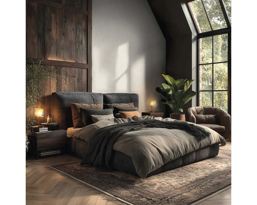 Modernes Schlafzimmer mit gepolstertem Bett, dunkler Holzwandverkleidung, Fenster, Ledersessel und Zimmerpflanze auf Fischgrätparkett.