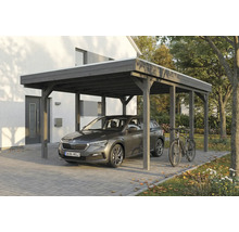 Holzcarport mit Auto und Fahrrad vor einem Haus