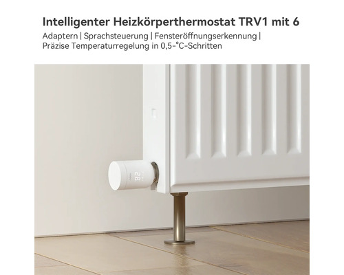 Intelligenter Heizkörperthermostat TRV1 montiert an einem weißen Heizkörper mit digitaler Temperaturanzeige.