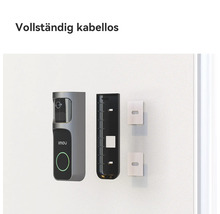 Vollständig kabellose Imou Videotürklingel mit Imou Logo, Montagehalterung und Klebestreifen zur Wandmontage.