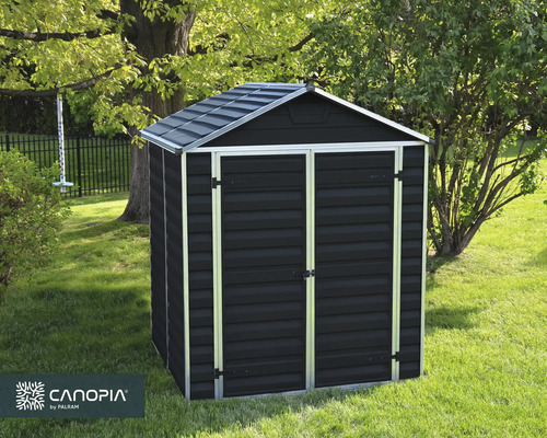 Modernes dunkelgraues Gerätehaus mit Doppeltür und Satteldach auf einer Rasenfläche im Garten. Canopia by Palram Logo.