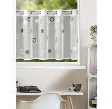 Transparente Bistrogardine mit Ösen und modernem Kreismuster vor einem Fenster in einem hellen, organisierten Arbeitszimmer.