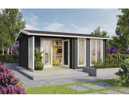 Modernes Gartenhaus aus Holz in Anthrazit mit weißen Fenstern und Türen, eingerichtet als helles Homeoffice auf einer Steinterrasse im Garten.