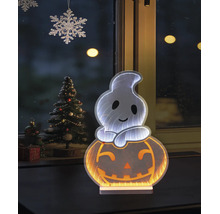 LED-Halloween-Dekoration Geist auf Kürbis mit Infinity-Effekt vor einem Fenster neben einem geschmückten Tannenbaum.