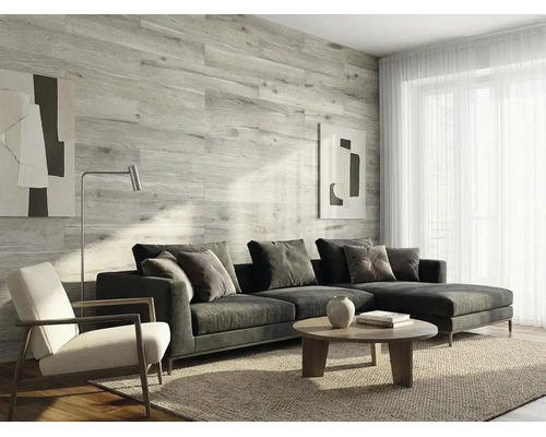 Modernes Wohnzimmer mit Wandverkleidung in heller Holzoptik, grauem Ecksofa, Couchtisch und Teppich. Helle und strukturierte Atmosphäre.