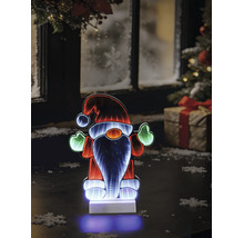 LED-Weihnachtswichtel mit Infinity-Spiegeleffekt auf einem Tisch vor einem winterlichen Fenster mit Weihnachtsbaum und Geschenk.