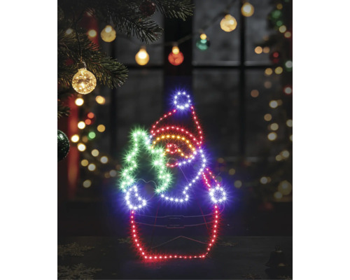Leuchtende LED-Silhouette eines Weihnachtsmanns mit Tannenbaum auf einem Drahtgestell in einer festlich dekorierten, weihnachtlichen Umgebung.