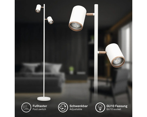 Moderne Stehlampe mit zwei schwenkbaren GU10 Spots, Fußschalter und weißem Metallrahmen mit Holzdetails.