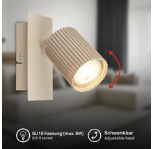Wandspot mit geriffeltem, schwenkbarem Kopf und GU10-Fassung für maximal 9 Watt Leuchtmittel.